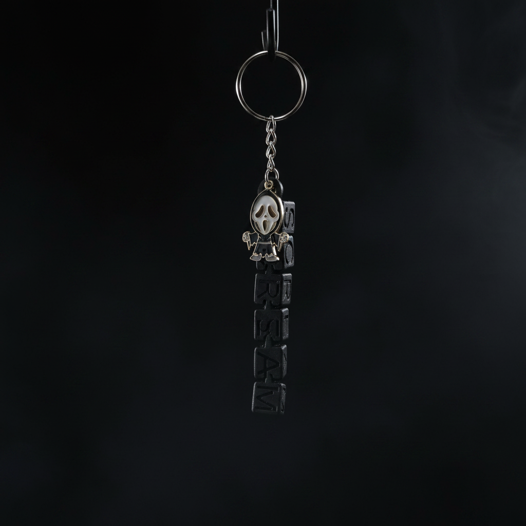 Chibi Ghostface keychain dark version on pitch black background