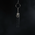 Chibi Ghostface keychain dark version on pitch black background