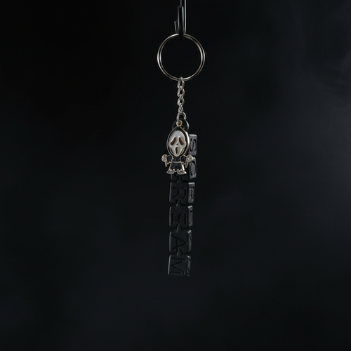 Chibi Ghostface keychain dark version on pitch black background