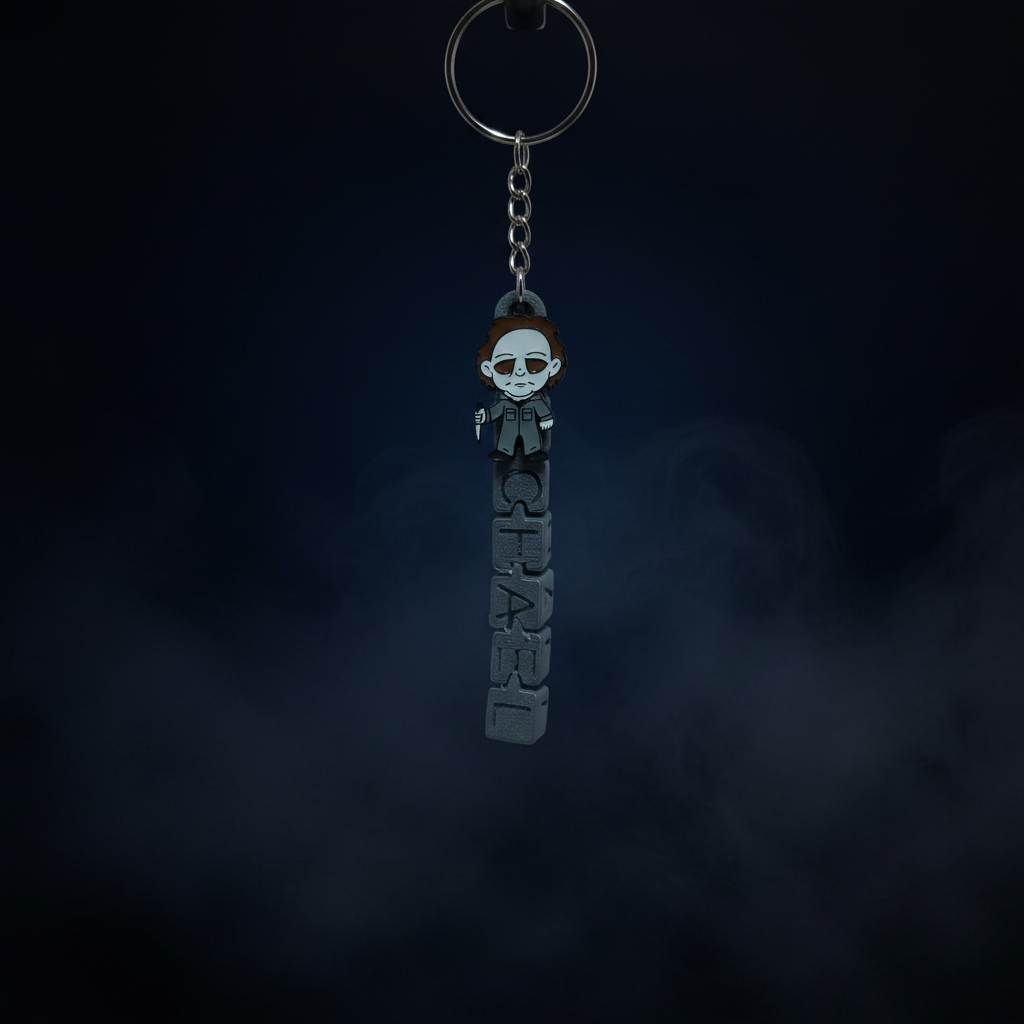Chibi Michael Myers keychain close-up no stand on midnight blue foggy background