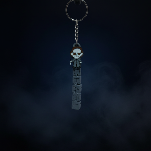 Chibi Michael Myers keychain close-up no stand on midnight blue foggy background